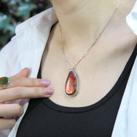 Whole piece of Canadian ammolite stone. Color changing from red to green, high flash red color.